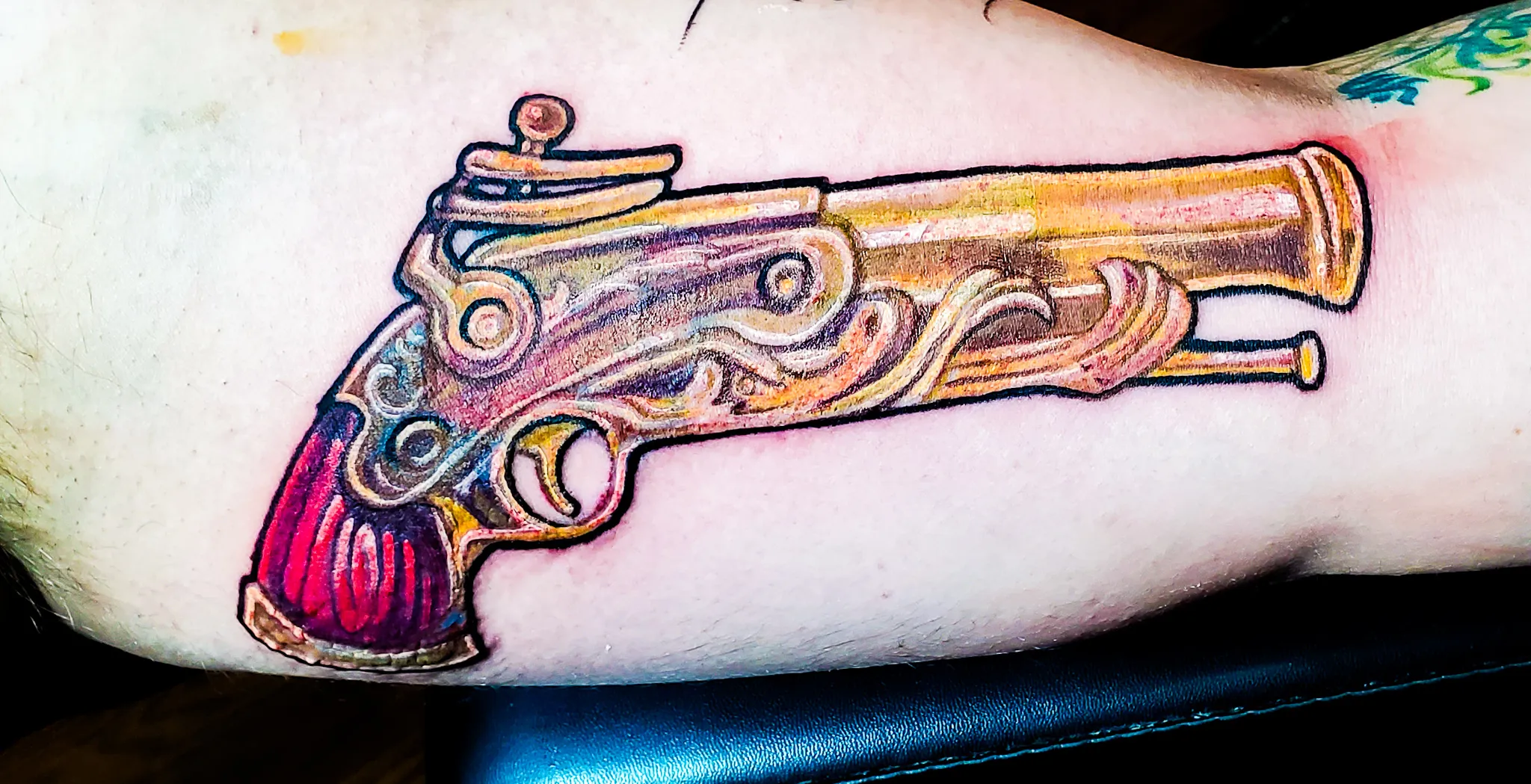 078-Pirate Pistol Cover-Up Tattoo in Full Color on Left Bicep – Daniel Collins – Premium Tattoo Artistry