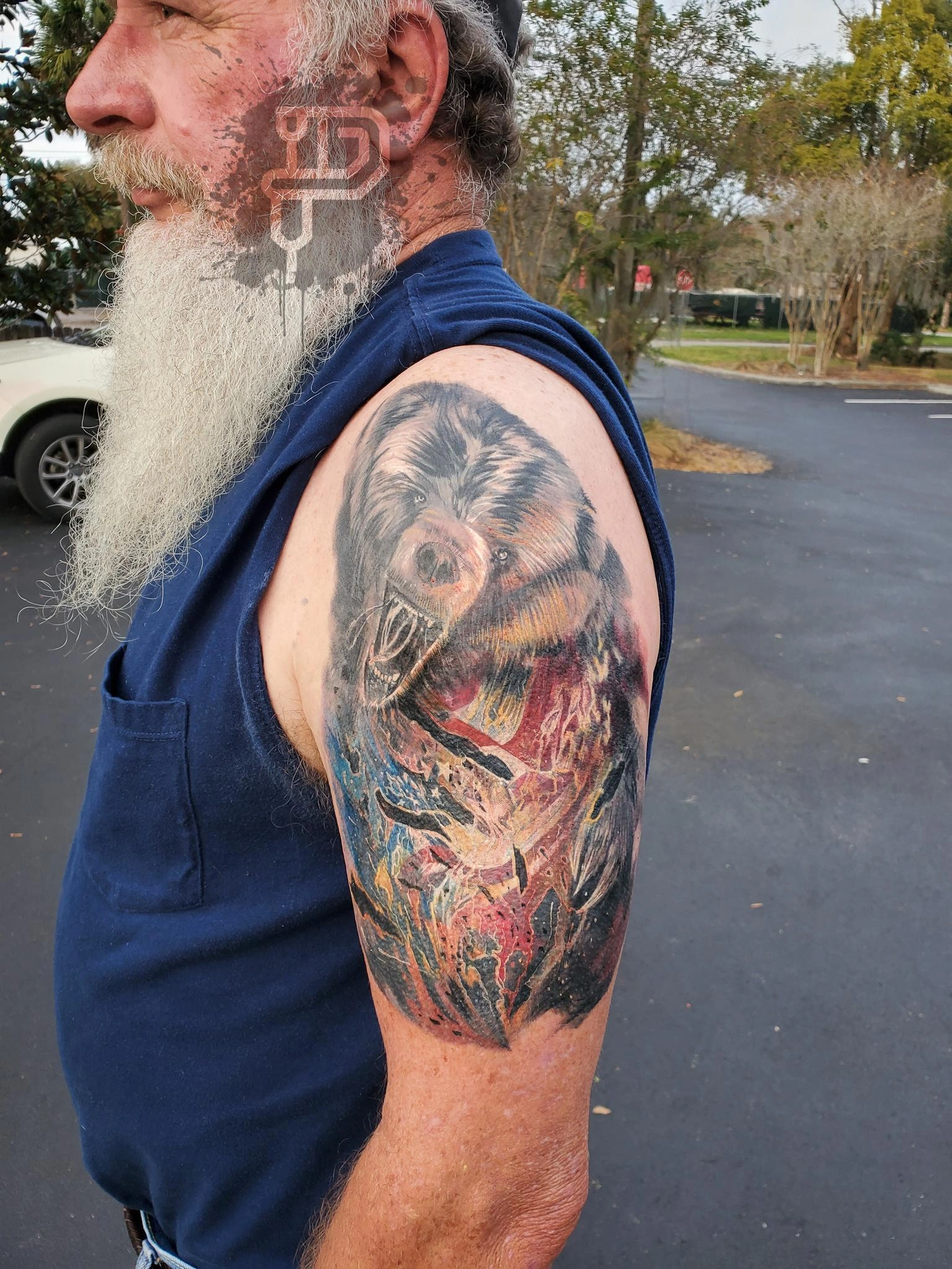 bear-tattoo-coverup-us-flag-flames-left-side-full-color-austin-premium-tattoo-artistry-daniel-aaron-collins