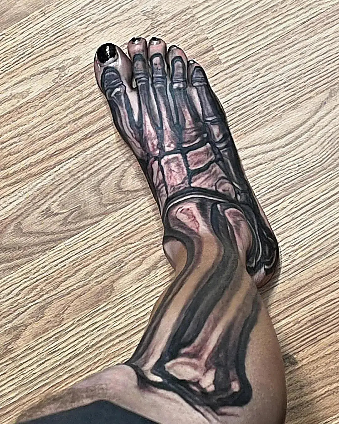 Anatomy in ink: Realistic skeleton tattoo on the lower leg and foot.