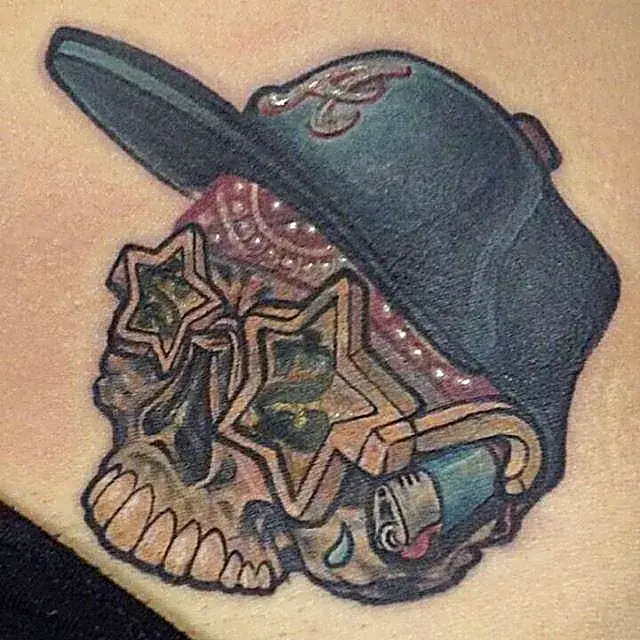 Streetwise revival: Skull tattoo cover-up with Atlanta cap and bold urban flair.